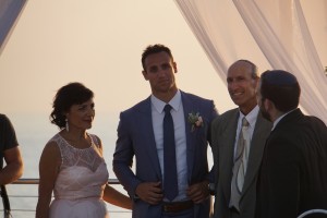 The groom with mother, father and rabbi   